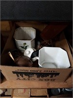 Box of flower pots and copper tea kettle