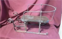 Vintage Toy Sleigh wood seat, iron frame.