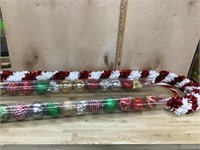 2 Tubes of ornaments and 2 large candy cane