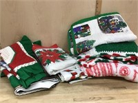 2  Stacks of Christmas blankets and table linens
