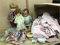 Box lot of doll clothes / porcelain doll and