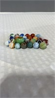 25 flame type and calligraphy type marbles mostly