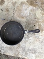 Large footed cast iron skillet