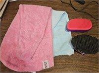 Two Twisty Turbie type towels and 2 detangle