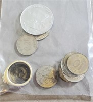 Bag of foreign coins and a costume ring