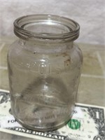 Antique embossed poison advertising glass jar