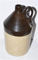 Primitive 12” brown and white pottery handled