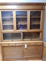 Tall wood storage filing cabinet with glass doors