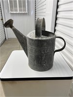 Vintage metal watering can