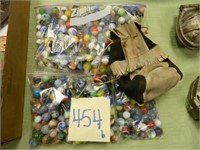 (4) Bags of Marbles & Marble Pouch