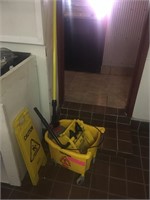 MOP AND CAUTION SIGN