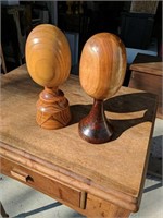 Two Vintage Handmade solid wood eggs on pedestals