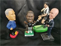 Three Bobblehead figures and a Soccer Player