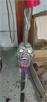 Zombie head on a stake