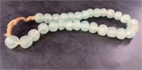 Large sand cast light green glass beads about 24"