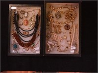 Two containers of costume jewelry: Western