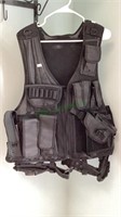 Large black tactical/shooting vest. Currently,