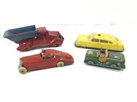 Group of four small antique toy cars