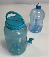 Blue plastic drinking jugs
