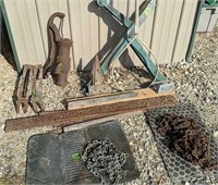 Pitcher Pump, Chain, Log Holders Etc. In Front