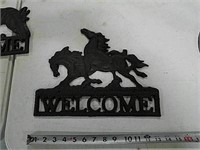 Cast iron horse "Welcome" sign.