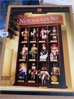 12 NUT CRACKERS IN DISPLAY CASE FROM CHRISTMAS,