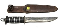 Fighting knife with leather sheath