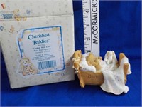 Cherished Teddies cradeled with Love