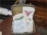 Suitcase of embroidery, stamped quilt squares