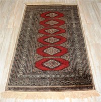 Persian hand woven Bokhara style rug, approximatel