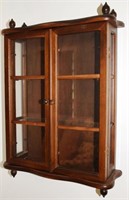 Mahogany 2 door hanging curio cabinet with acorn f