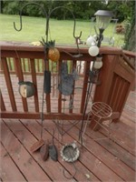 Group of flower spikes, wind chimes and plant
