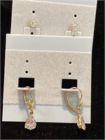 Two pair of fashion earrings. One pair of dangles