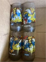 4 glasses depicting THE SMURF’S and 4 glasses