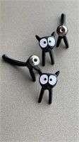 New 2 pc earrings. Wide eyed black cats, back