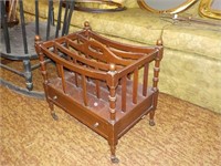 Antique magazine rack, metal castors