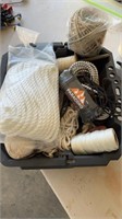 Plastic tote full of ropes,paracord, string and