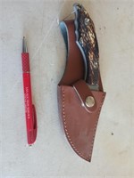 4 and 1/2-in skinning  knife with serrated edge