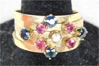 Marked 18K y gold multi band ring, 4 sapphires,