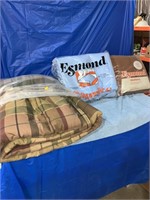 A double brown comforter, a double blue blanket