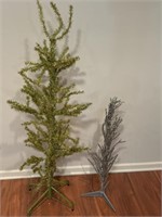 2- stick glitter Christmas trees, one stands 4