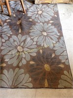 Floral area rug approx. 11 feet long, ruffled on
