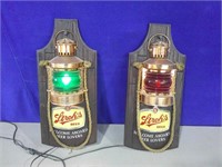 two Strohs lantern signs