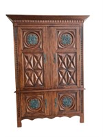 A Heavily Carved Wood TV Cabinet