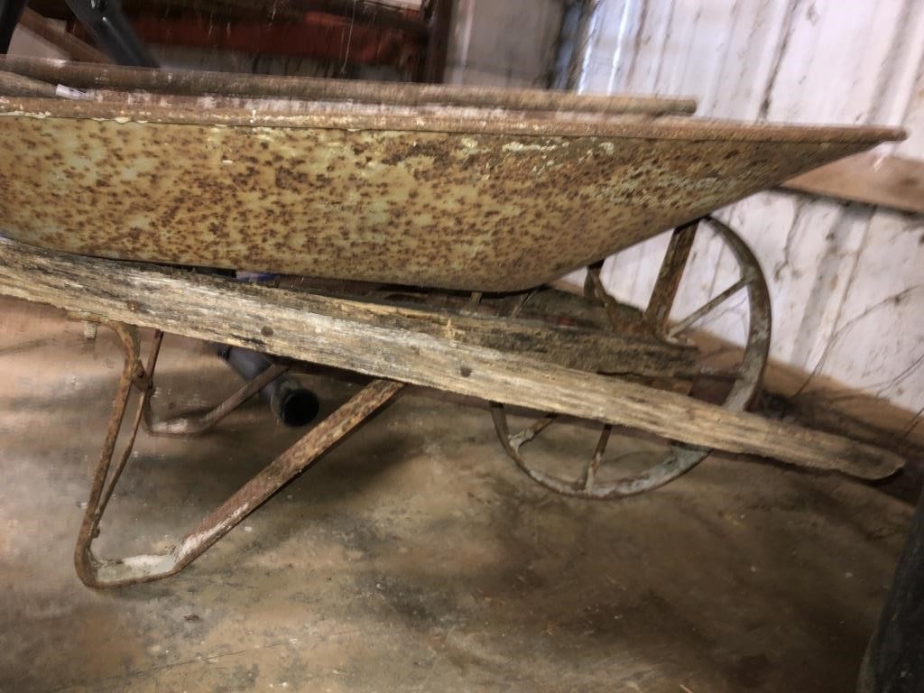 Iron wheeled wheel barrow *needs handles replaced