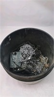 Bucket of chains and screws