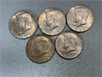 Five 1967 Kennedy half dollars