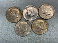 Five 1965 Kennedy half dollars