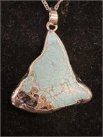 Sterling silver encased natural turquoise stone