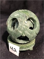 Carved jade ball inside a ball inside a ball that